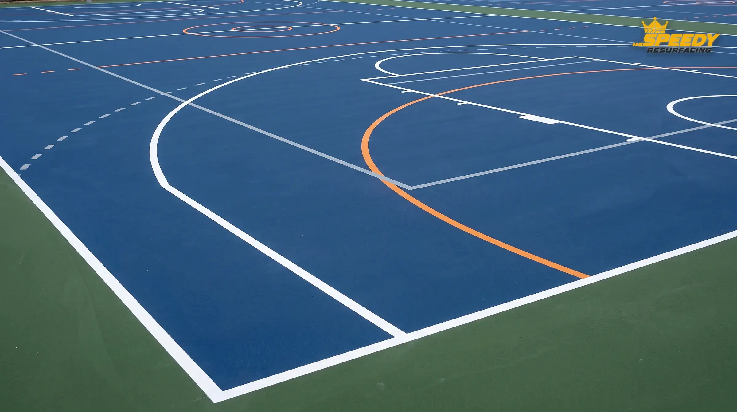 Three sports, one surface, zero confusion: bold white basketball, orange netball, subtle broken grey pickleball — the hierarchy tells players which line is theirs at a glance.
