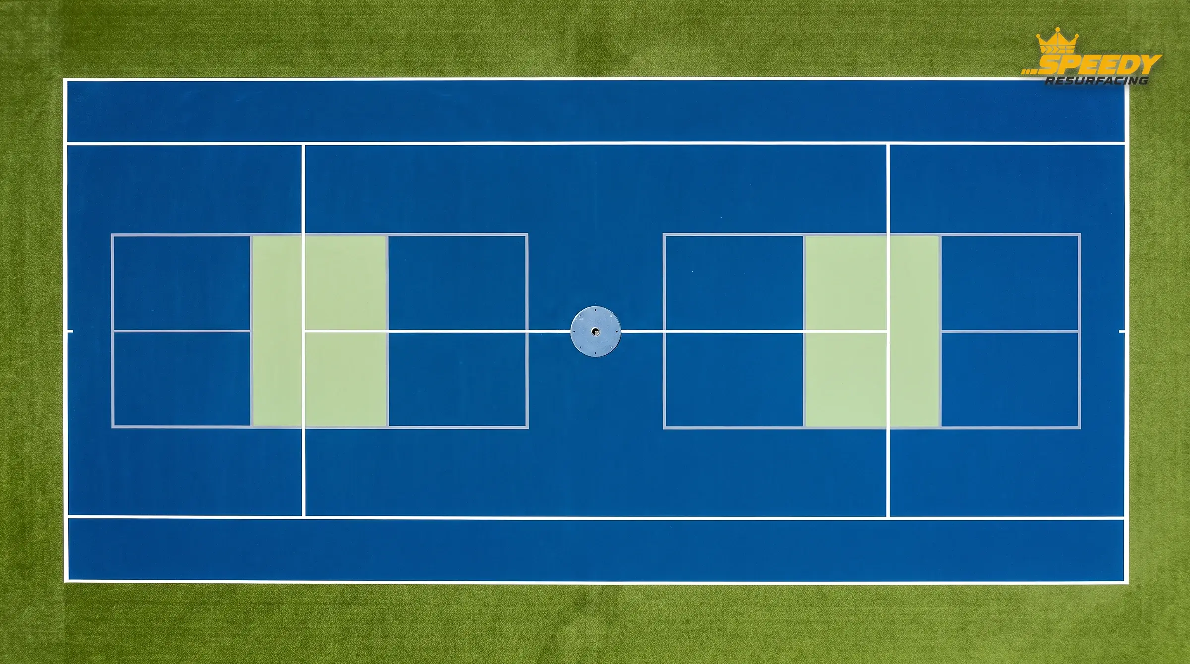 A tennis court carrying two pickleball overlays: white tennis lines stay primary, pickleball boundaries sit in a lower-contrast grey, kitchens are colour-zoned and a net-post sleeve is set into the slab.